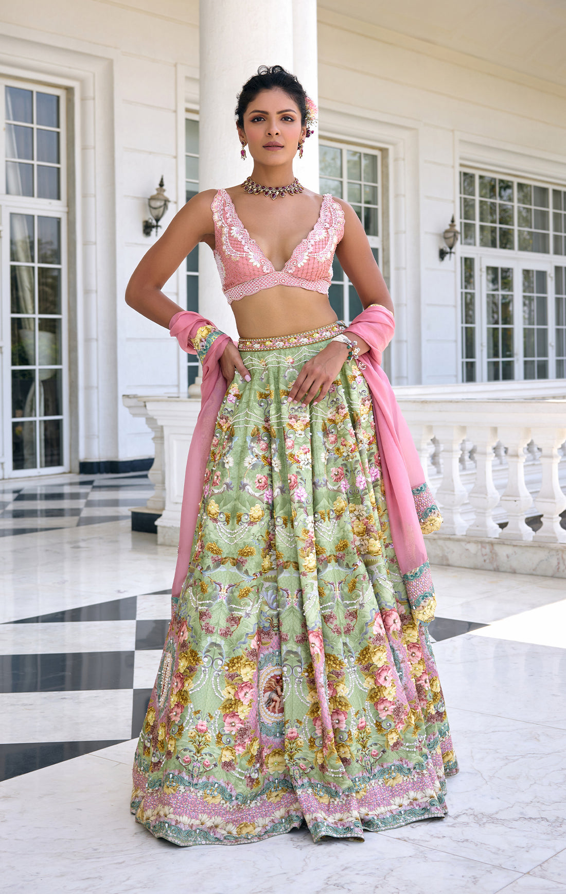 Eye-catching pink and green colour pairing crafted for warm-season events Elegant silhouette designed for unforgettable reception entrances Deeply feminine styling with a modern, fresh sensibility
