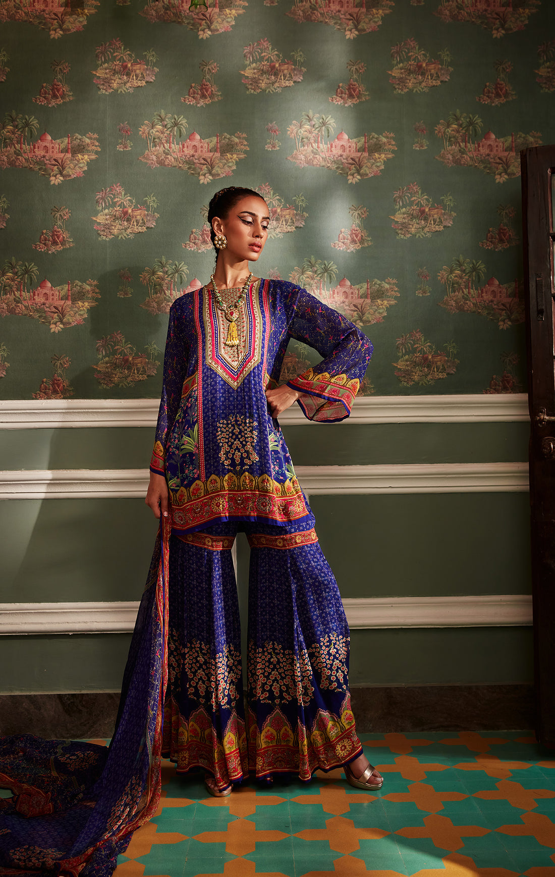 Steeped in Mughal heritage, the Kalista designer g harara suit is for the bride who wants her outfit to carry history. Heavily embroidered, dramatically flared, and deeply intentional — this is a look that commands attention without asking for it.