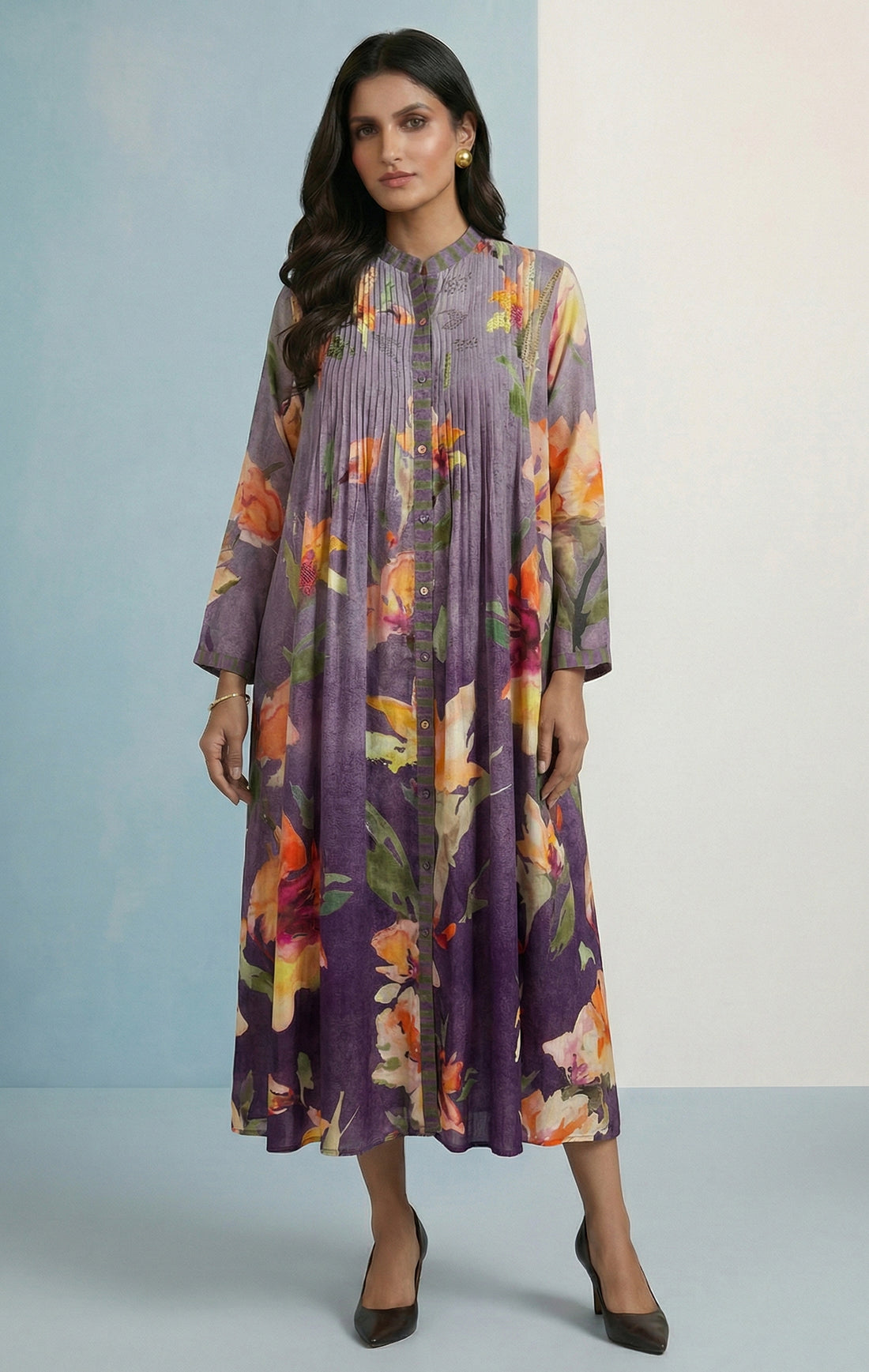 Styling it as a mix and match rakhi outfit: A contrast dupatta draped over the shoulders, traditional juttis, and a stack of colourful bangles — it's the kind of fusion look that R