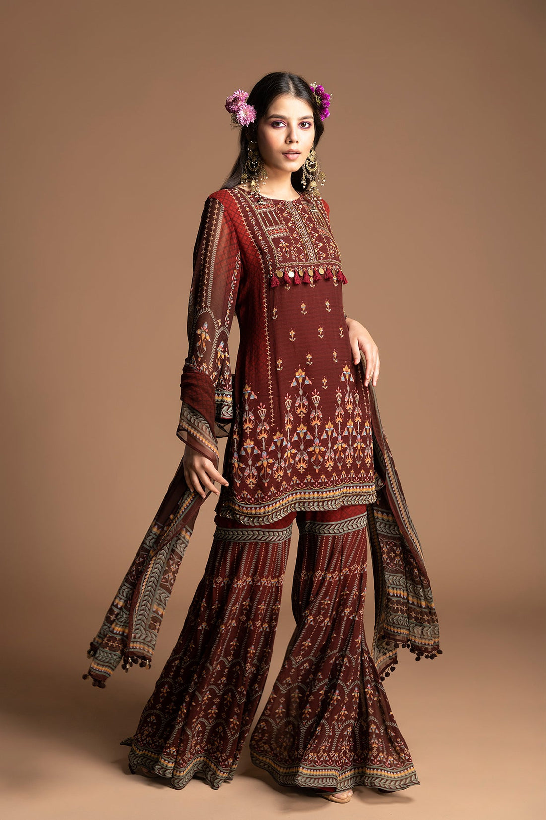 The Myra Gharara Set in maroon georgette is everything for this night. Geometric floral beadwork, coordinated kurta, fluid fabric that flares when you move. Glamorous and comfortab